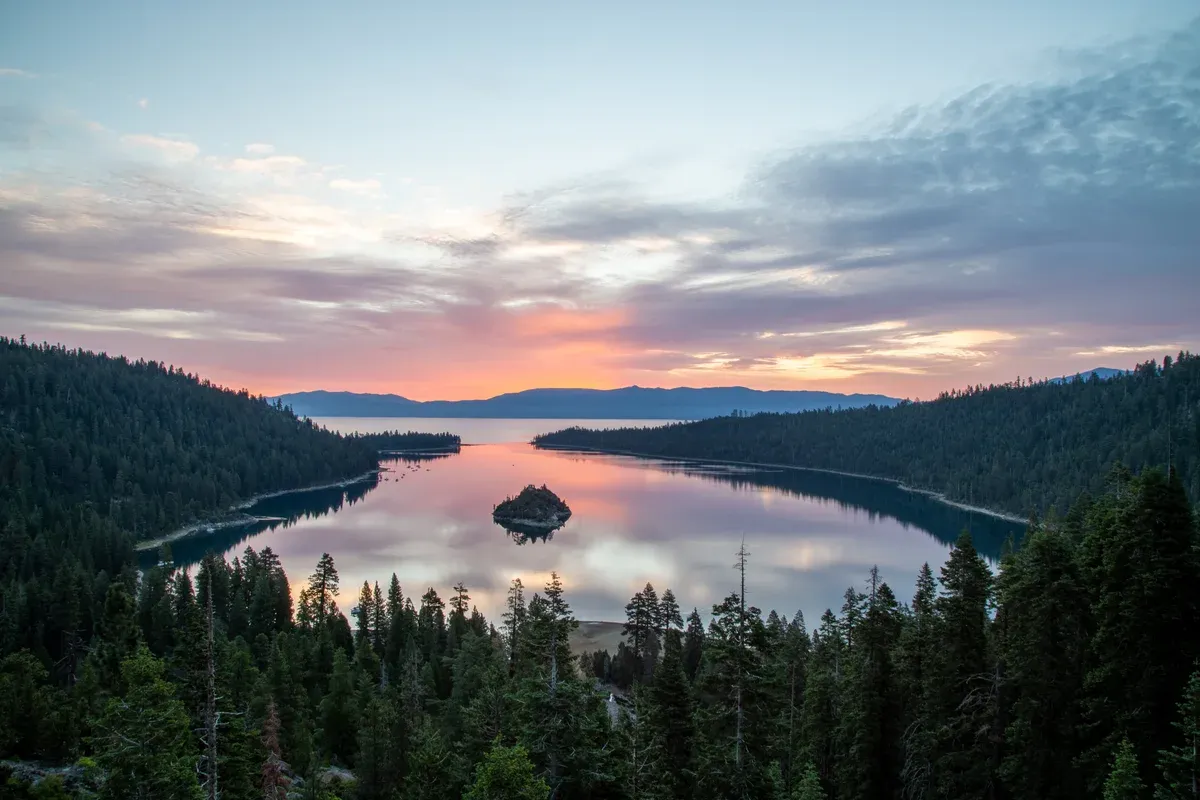 Emerald Bay under a pink sky with Fannette Island in the middle of the still bay